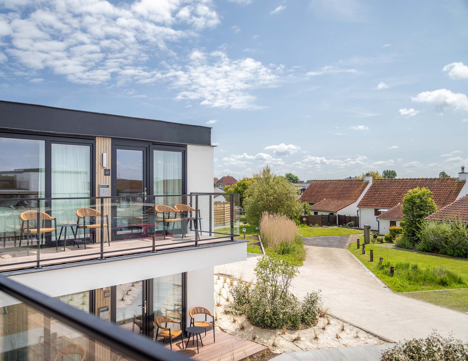 The natural pool and terraces of Hotel & Aparthotel Zeegalm, in the Warandeduinen